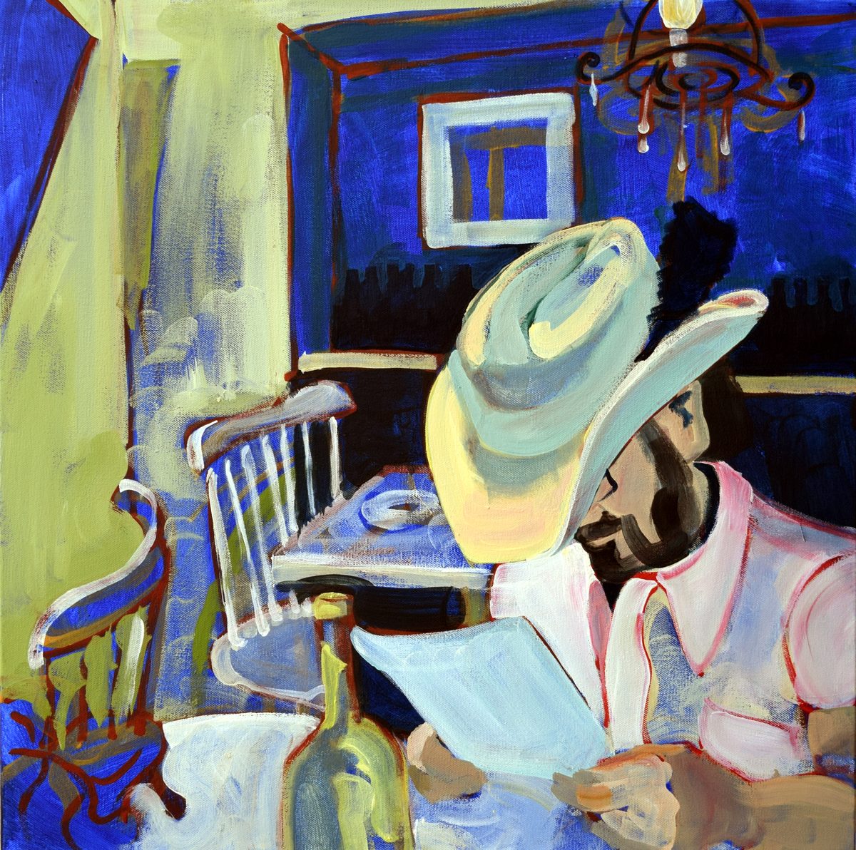 Blue Cowboy: a man in a pale cowboy hat reads a menu at a table in a cobalt blue room beneath a chandelier