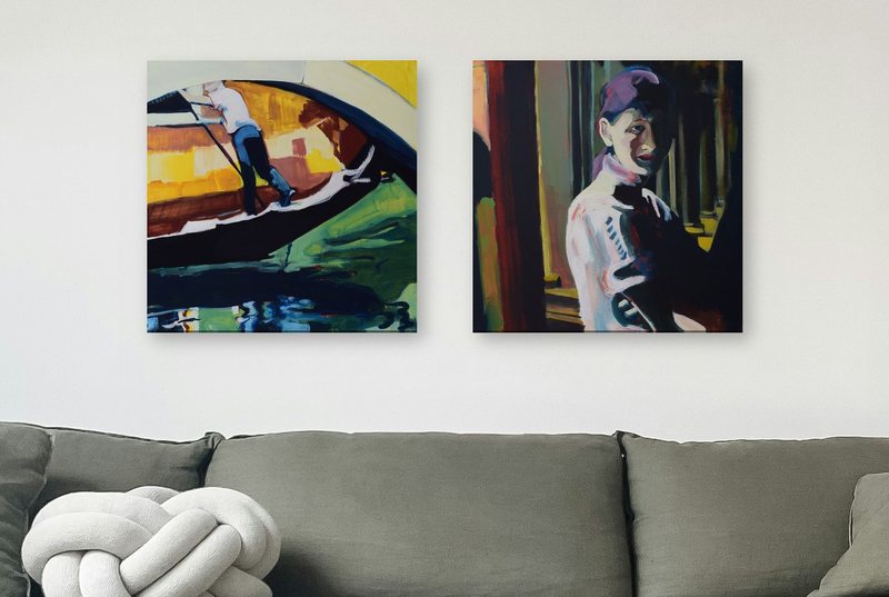 Digital mockup: In an Instant and The Lady of Palermo hung side by side above a grey linen sofa